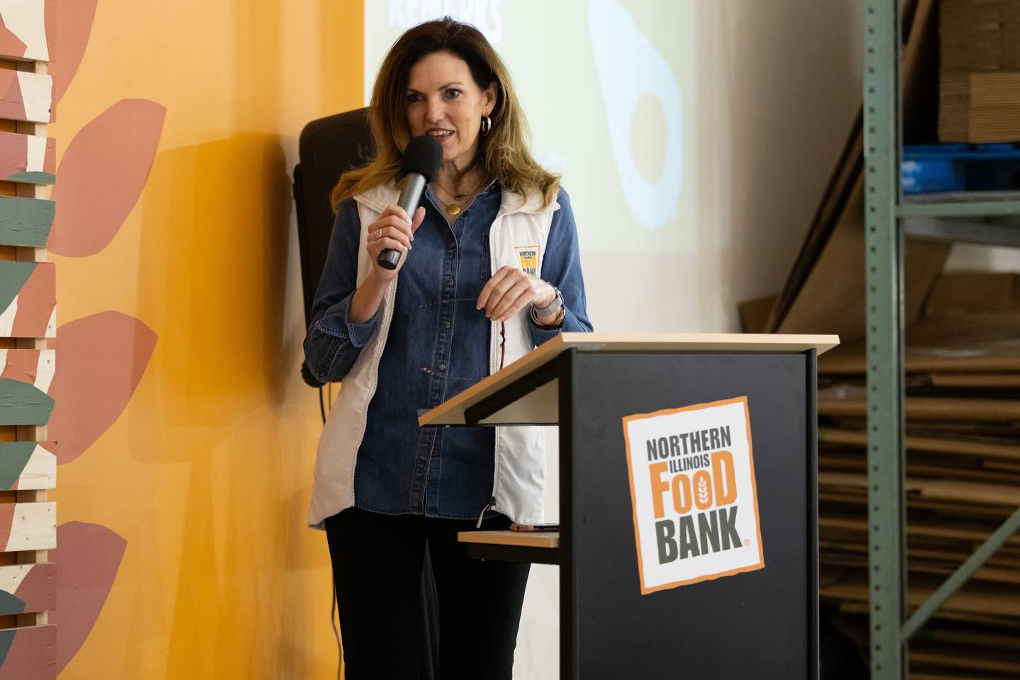 Julie Yurko, President and CEO of Northern Illinois Food Bank, delivers remarks at the S.E.E.D. graduation at the Northern Illinois Food Bank South Suburban Center in Joliet on March 14, 2024.