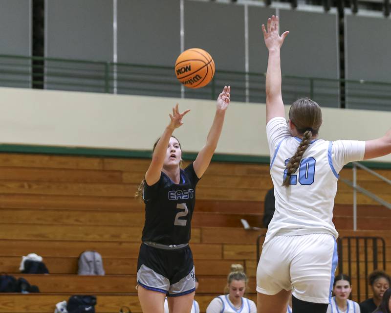 Oswego East's Annabelle Williams (2) shoots a three pointer during their York Thanksgiving Tournament matchup between Oswego East at Downers Grove South Friday, Nov 20, 2025 in Elmhurst.