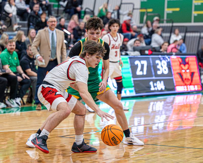 Greyson Bickett (0) of Hall dribbles ball whilst being guarded by James Zydron (3) of Seneca during game in the Shipyard Showdown on Tuesday, December 23, 2025 at Seneca High School in Seneca.
