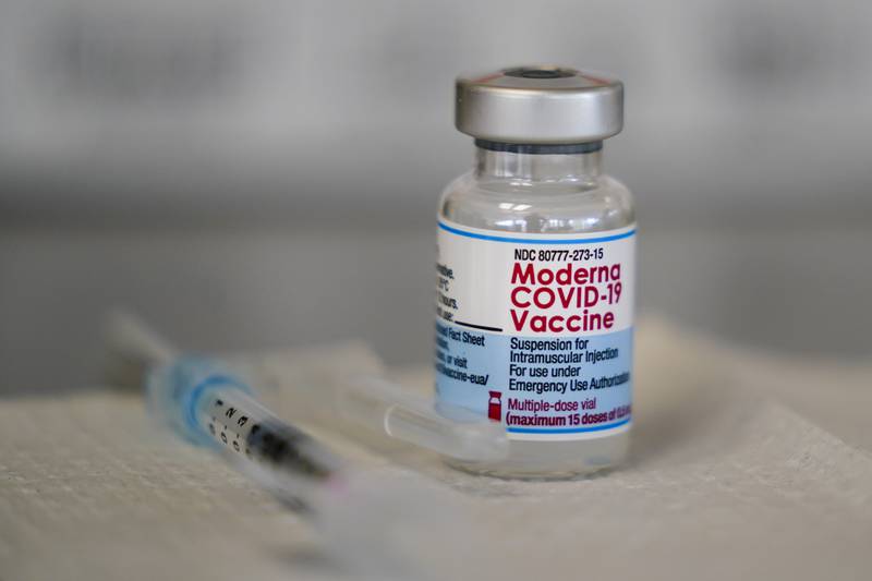 FILE -  A vial of the Moderna COVID-19 vaccine is seen during a vaccination clinic at the Norristown Public Health Center in Norristown, Pa., Tuesday, Dec. 7, 2021. Moderna said Monday, Dec. 20, 2021 that a booster dose of its COVID-19 vaccine should offer protection against the rapidly spreading omicron variant.