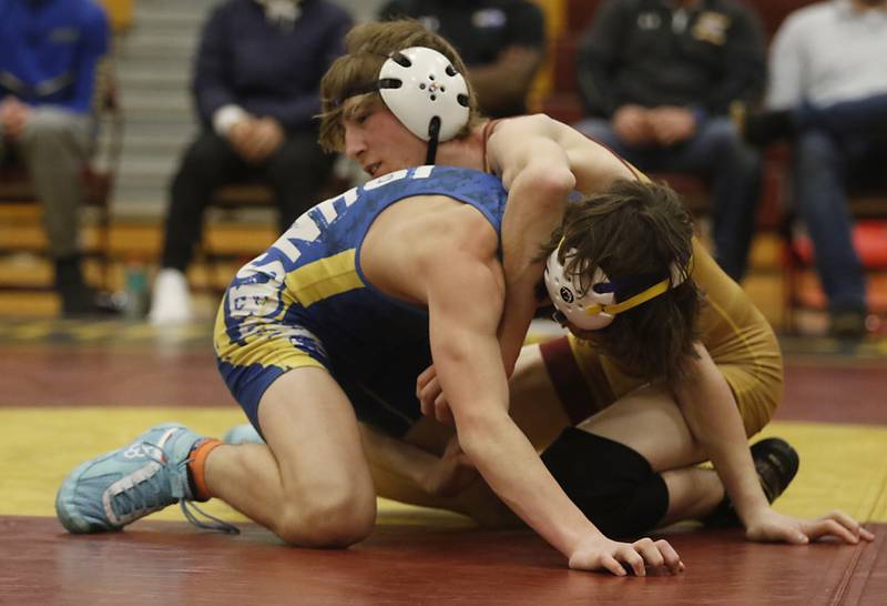 Richmond-Burton's Clay Madula tries to control Johnsburg's Cameron Sweeney during the 120-pound match of a Kishwaukee River Conference wrestling match on Thursday, Jan. 25, 2024, at Richmond-Burton High School.