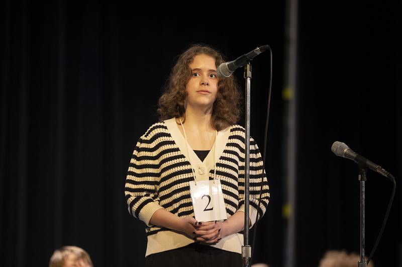 Centennial Elementary fifth grader Mykaela Arnold appears on stage Thursday, March 9, 2023 during the Lee-Ogle-Whiteside Regional Spelling Bee.