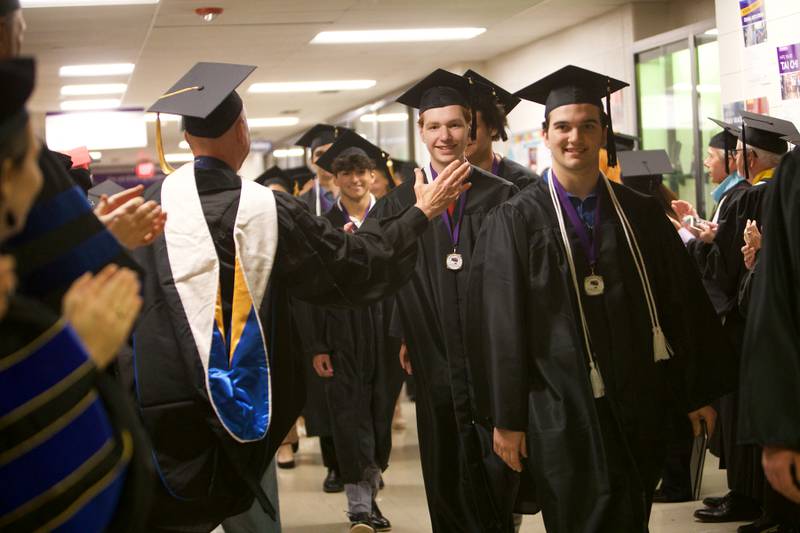 Graduates are applauded after the Graduation Ceremony at McHenry County College on Saturday May 11,2024 in Crystal Lake.
