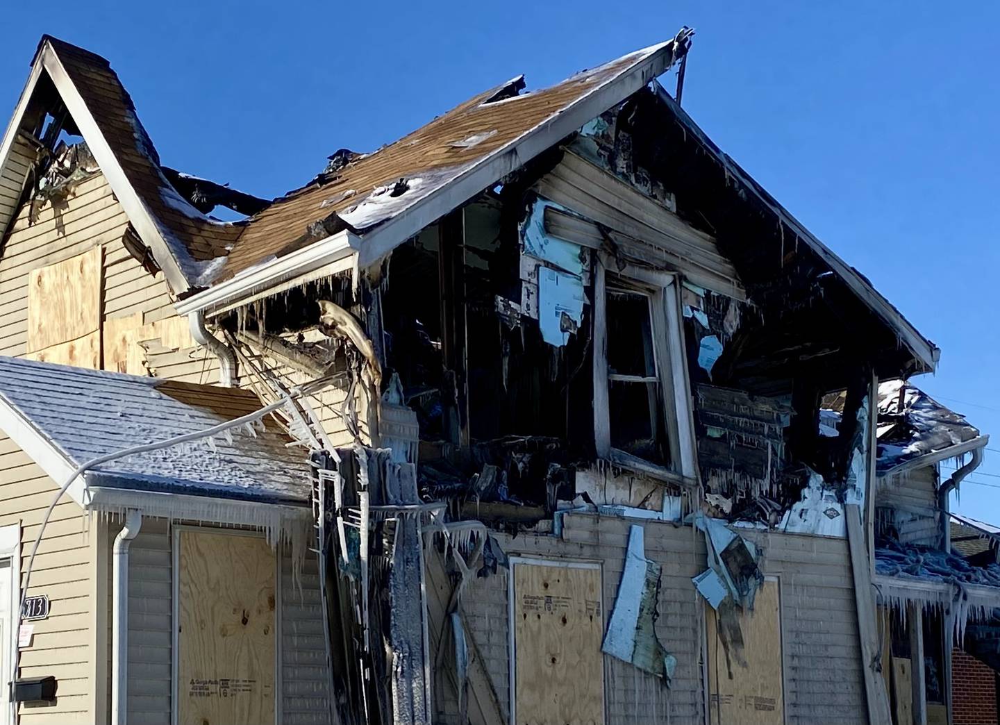 The collapsed roof is seen in the aftermath of a major fire at a two-story duplex on Monday, Jan. 26, 2026, in the 700 block of East Lincoln Highway in downtown DeKalb. Fire ravaged the home, displacing two residents and injuring three firefighters, on Saturday, Jan. 24, 2026.