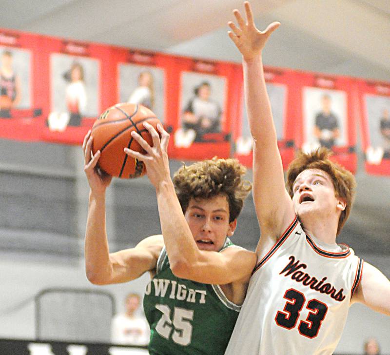 Dwight's Joey Starks grabs a defensive rebound ahead of Woodland's Kenny Eutsey at the Warrior Dome on Friday, Jan. 13, 2023.