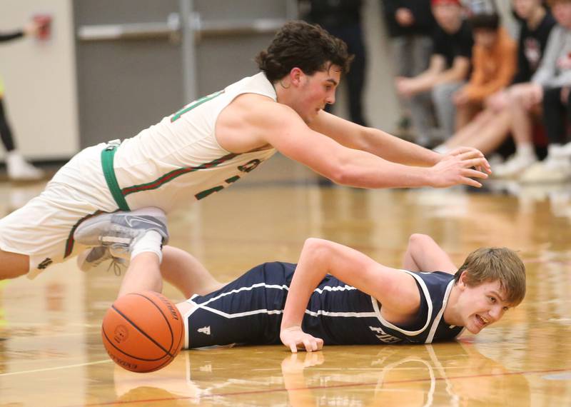 L-P's Josh Senica and Fieldcrest's Edmond Thorton dive for a loose ball during the 49th annual Colmone Classic on Friday, Dec. 8, 2023 at Hall High School.