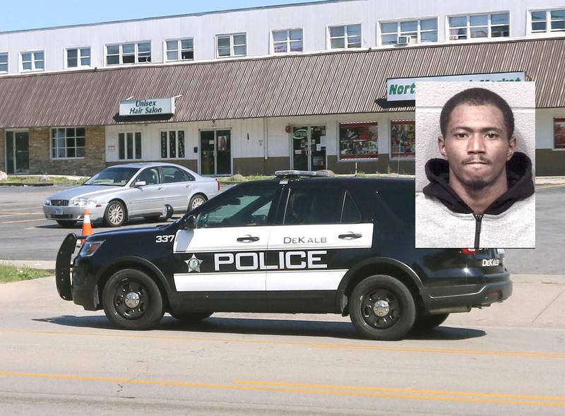 A DeKalb Police Department vehicle drives down Hillcrest Drive Monday near Greenbrier Road past a strip mall where a shooting occurred Sunday night leaving one man dead. Police have been driving by the scene frequently since the shooting happened.