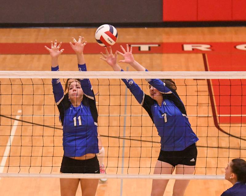 Geneva's Caitlyn Potvin (11) and teammate Jordan Davenport (7) try to block the ball during the sectional tittle game against Nazareth Academy held at Timothy Christian High School.