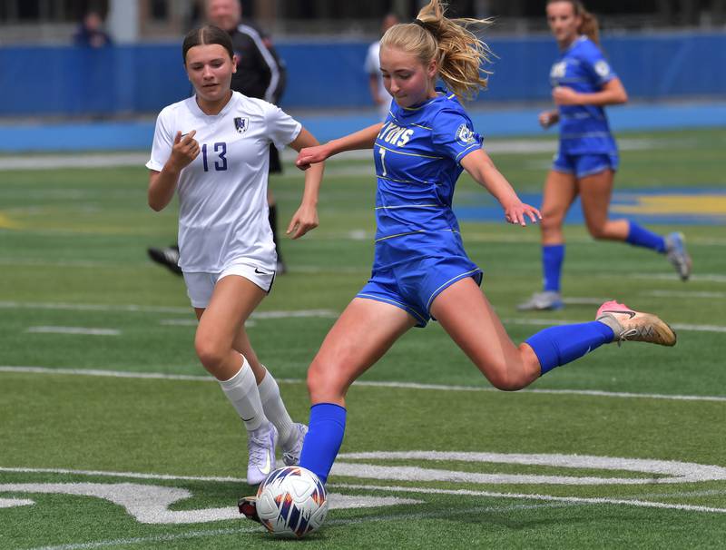 Lyons Township’s Elise Novey takes a shot as Downers Grove North’s Grace Watland (13) defends during their Class 3A Lyons Regional final on May 23, 2026 at Lyons Township High School in LaGrange.