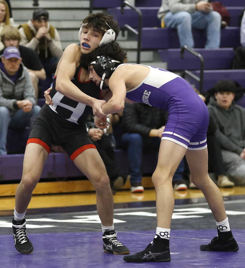 Huntley's Colin Abordo tries to take down Hampshire's Deegan Kirschke during the 113-pound match of a Fox Valley Conference wrestling meet on Wednesday, Jan. 8, 2025, at Hampshire High School.