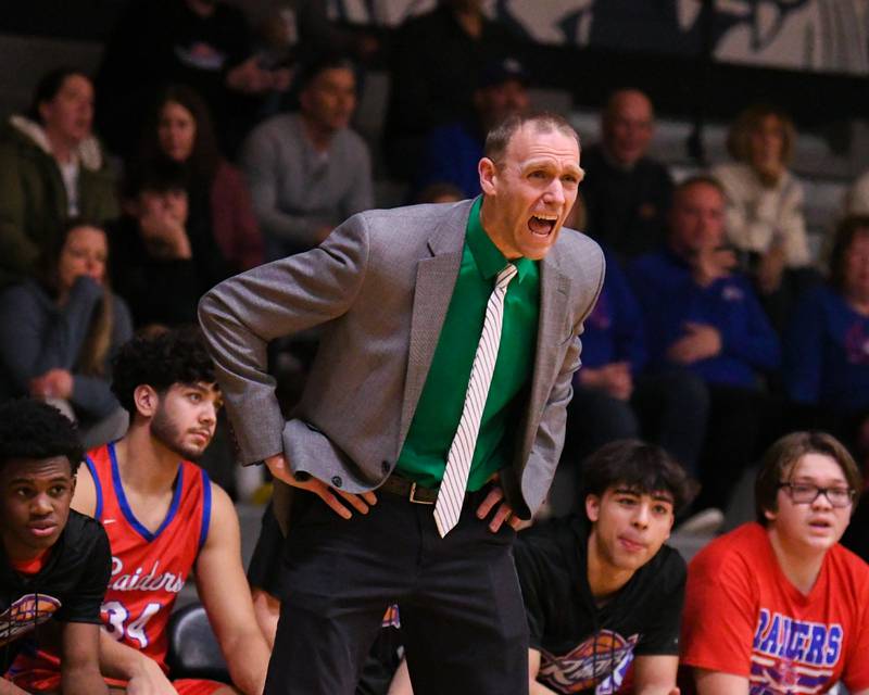 Glenbard South's head coach Jason Mead calls out to the team during the game on Friday Jan. 3, 2025, while traveling to take on West Chicago High School.