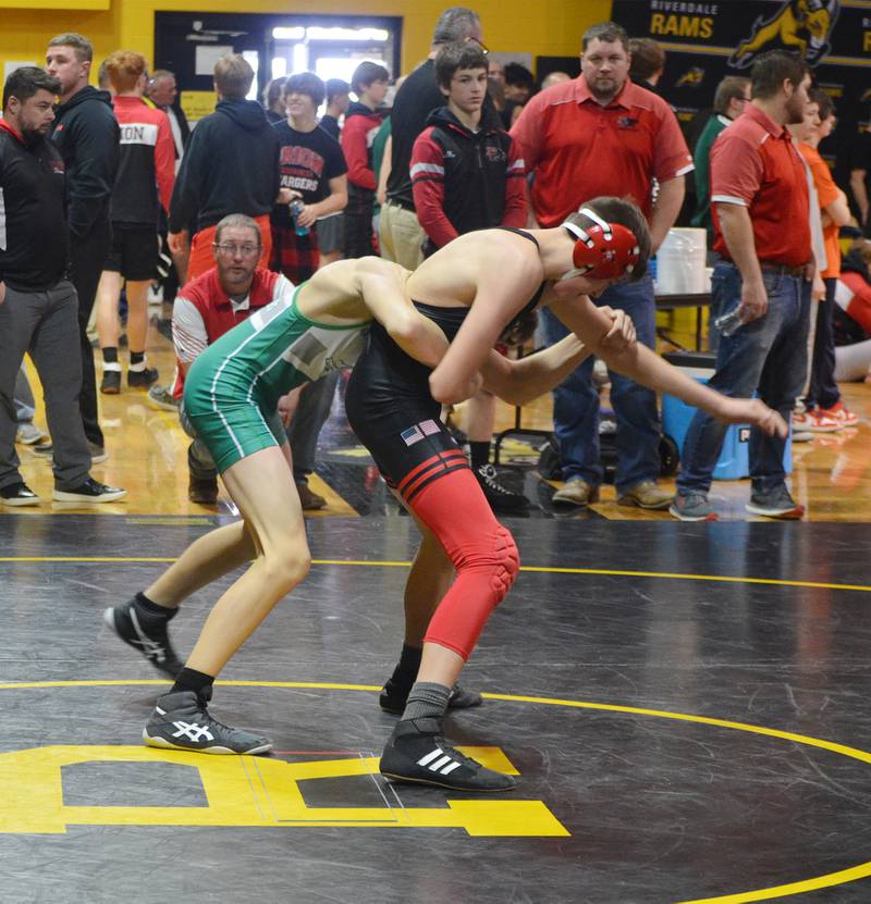 Erie-Prophetstown's Connor Johnson (right) tries to escape the grasp of Alleman's Will Hampton in a 113-pound consolation semifinal at the 1A Riverdale Regional on Saturday, Feb. 4, 2023.