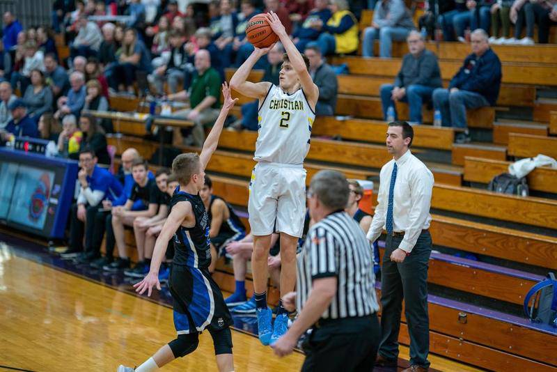 Yorkville Christian's Jaden Schutt (2) shoots a three pointer against Hinkley-Big Rock during the Plano Christmas Classic in Plano Dec. 26.