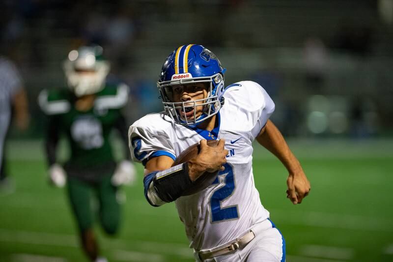 Joliet Central's Christian Smith runs the ball during a game against Plainfield Central on Friday Oct. 11, 2024 at Plainfield Central High School