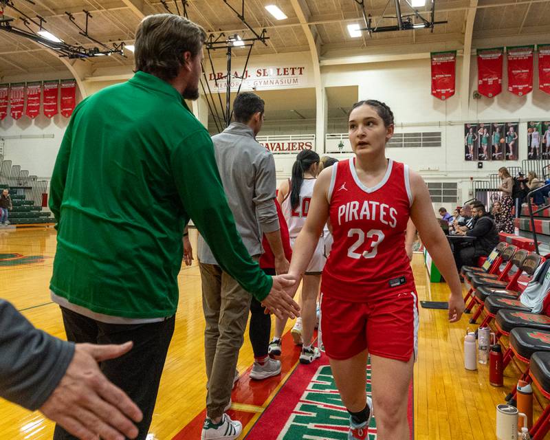 Mary Stisser (23) of Ottawa leads team in post game high-five line on Wednesday, December 17, 2025 at Sellet Gymnasium in LaSalle.