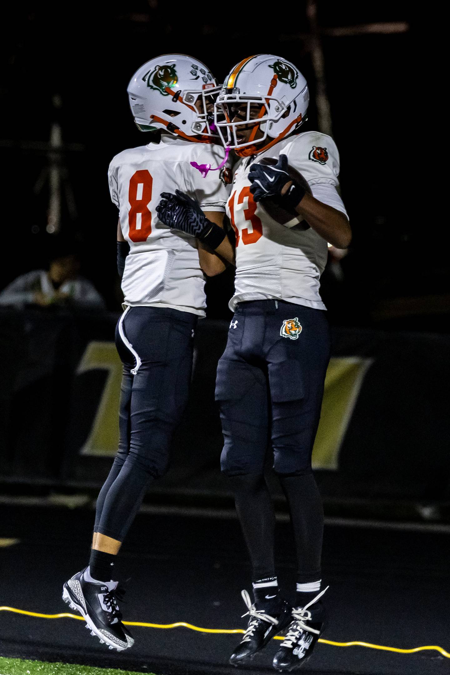 Plainfield East's Trevor Manuel celebrates with Markeith Taylor after Taylor scored a touchdown during a varsity football game against Joliet West at Joliet West on Oct. 10, 2025.