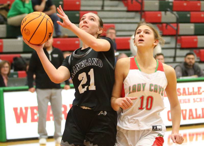 Kaneland's Kyra Lilly eyes the hoop as L='s Kelsey Frederick defends on Wednesday, Jan. 15, 2025 in Sellett Gymnasium at L-P High School.