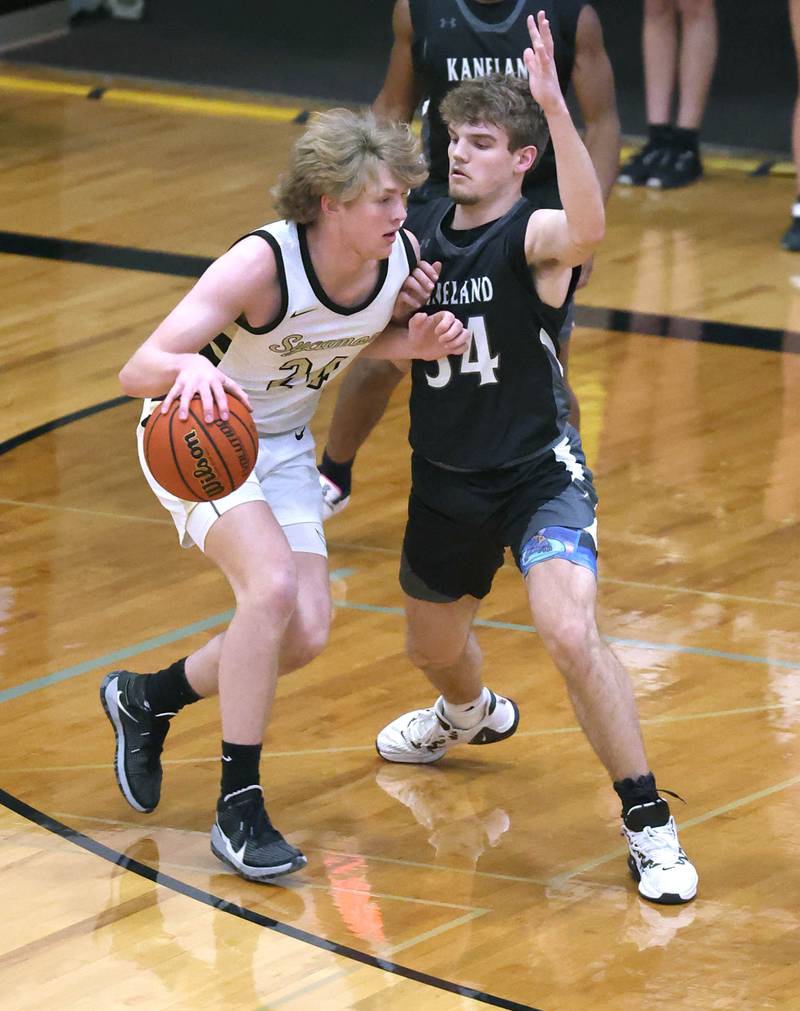 Kaneland's Parker Violett plays defense against Sycamore's Lucas Winburn during their game Friday, Feb. 10, 2023, at Sycamore High School.