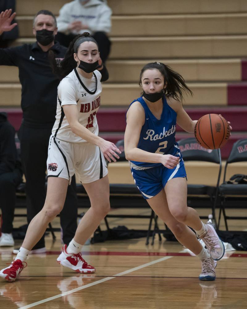 Burlington Central's Becca Carani gets past Huntley defender Jessie Ozzauto during their game on Saturday, January 29, 2022 at Huntley High School. Huntley won 52-49.