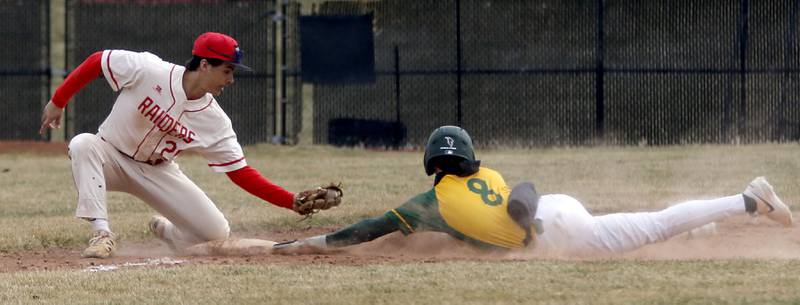 Huntley's Joey Lengle tries to tag Fremd’s Cole Seidel out at third base during a nonconference baseball game against Fremd on Tuesday, March 24 2026, at Huntley High School.