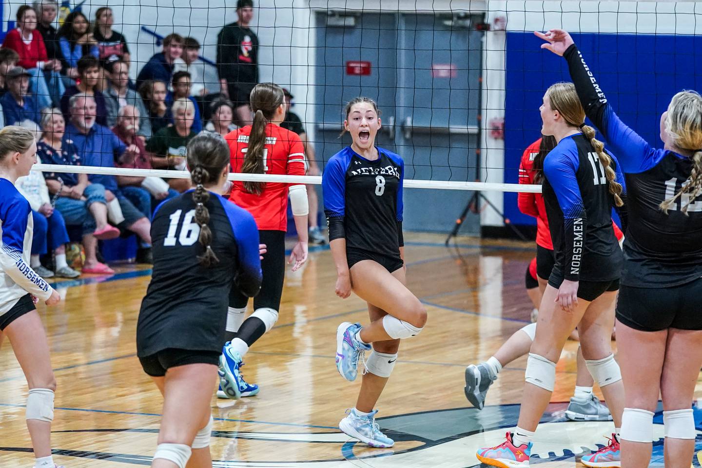Newark’s Heather Buhle (8) reacts after scoring a point on a kill against Aurora Christian during a non-conference match at Newark High School on Tuesday, Sept. 9, 2025.