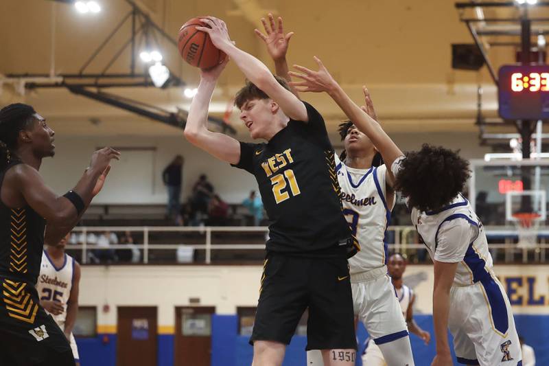 Joliet West’s Drew King pulls in a rebound against Joliet Central on Saturday, Jan. 27th, 2024 in Joliet.