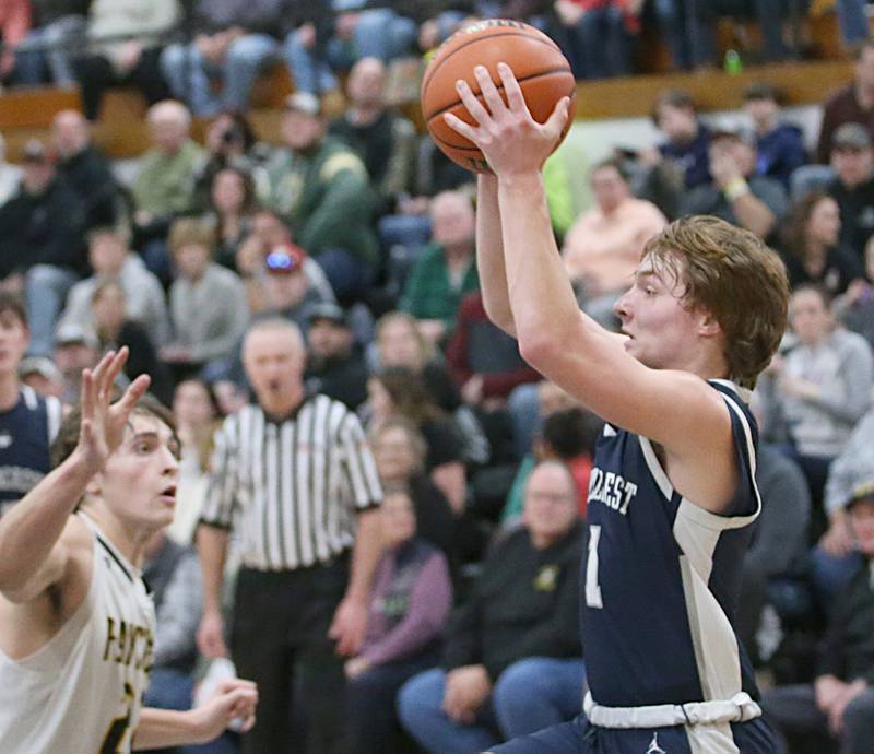 Fieldcrest's Nathan Cook runs in the lane to pass the ball off as Putnam County's Orlando Harris on Tuesday, Feb. 7, 2023 at Putnam County High School.