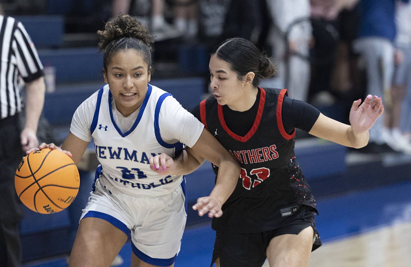 Newman’s Gisselle Martin drives against Erie-Prophetstown’s Ava Grawe Thursday, Jan. 29, 2026.