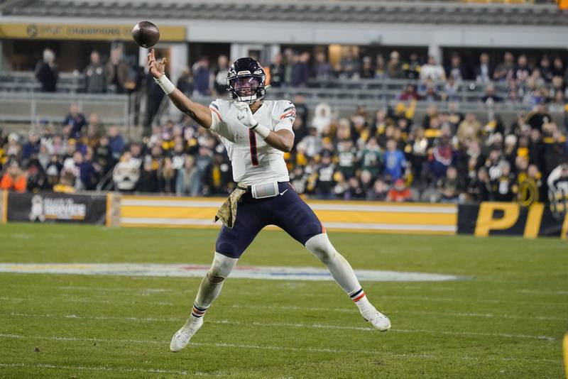 Chicago Bears quarterback Justin Fields passes as he scrambles during the second half Nov. 8, 2021 in Pittsburgh.