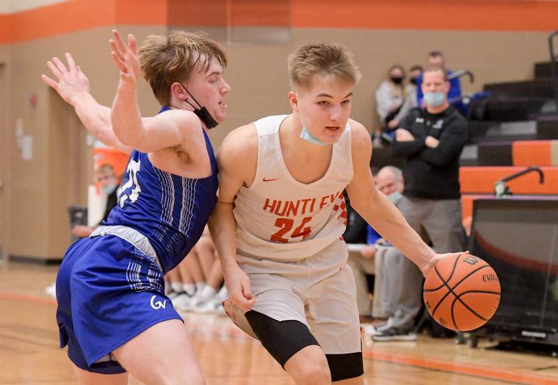 Huntley's Aiden Wieczorek drives around Geneva's Jimmy Rasmussen during the Chuck Dayton Classic in DeKalb on Thursday, Dec. 30, 2021.