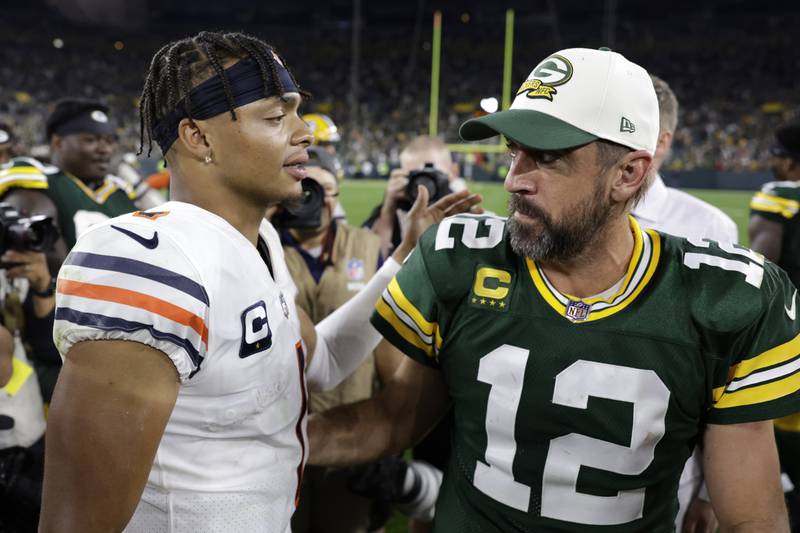 Green Bay Packers quarterback Aaron Rodgers talks with Chicago Bears quarterback Justin Fields after their game Sunday, Sept. 18, 2022, in Green Bay, Wis.
