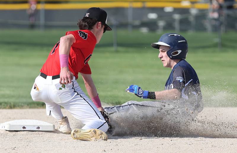 Indian Creek's Nik Nelson tags IMSA's Charlie Conner on a stolen base attempt during their game Monday, May 9, 2022, in Shabbona.