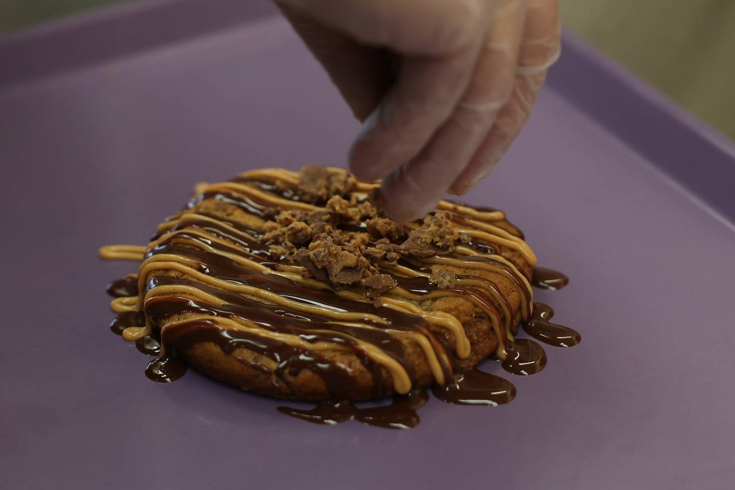 Steve Buresh makes the popular Peanut Butter Cup cookie at his newest bakery, Steve Buresh’s Cookie Store on Thursday, Nov. 21, 2024 in Plainfield.