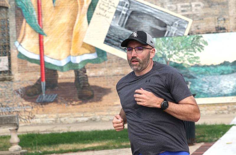 Shawn Beck, from DeKalb, runs west Wednesday, June 28, 2023, on Lincoln Highway between First and Second Streets in DeKalb. Beck recently completed his goal of running every street in DeKalb County.