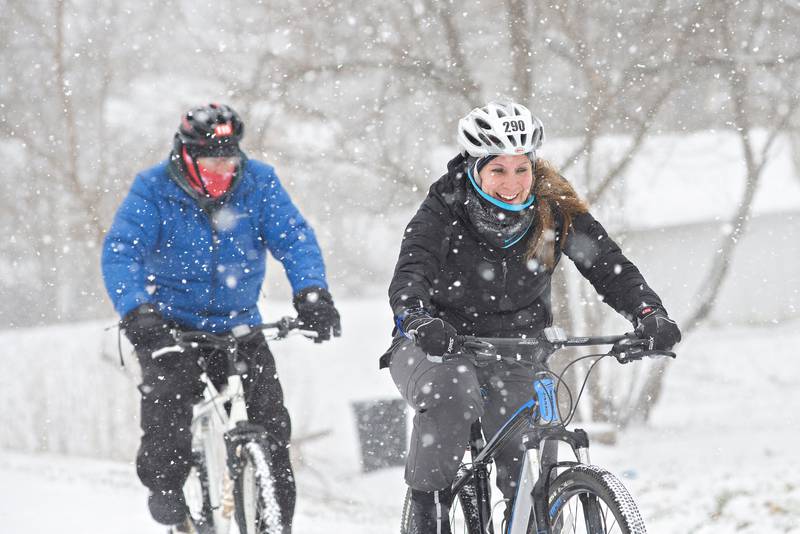 Dawn and Matt Moore lead the group of other cyclists as they head toward Lowell Park during the 32nd annual Rock River Valley Bicycle Club New Year’s Day ride.