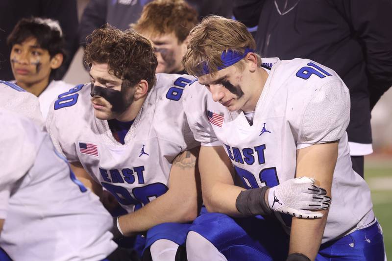 Lincoln-Way East’s David Wuske, left, and Caden O’Rourke listen to coach Zvonar after the loss against Loyola in the Class 8A championship on Saturday, Nov. 25, 2023 at Hancock Stadium in Normal.