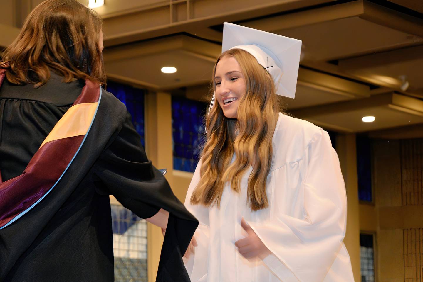 Sarah Wessels of Oswego accepts her diploma this year from Rosary High School in Aurora. The all-girls Catholic school will take on a new name as of July 1, 2025, Rosary College Prep.