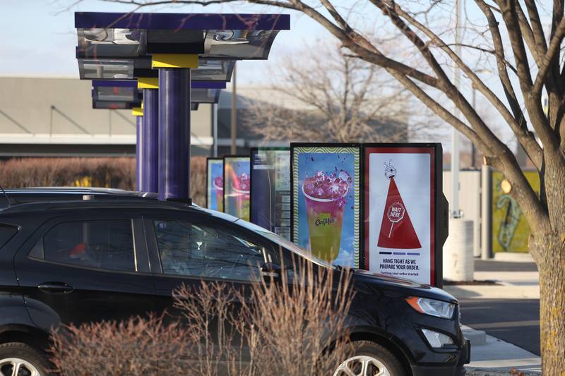 Customers place their orders at CosMc’s, McDonald’s first small format beverage driven concept drive-thru, on Friday, Dec. 8, 2023, in Bolingbrook.