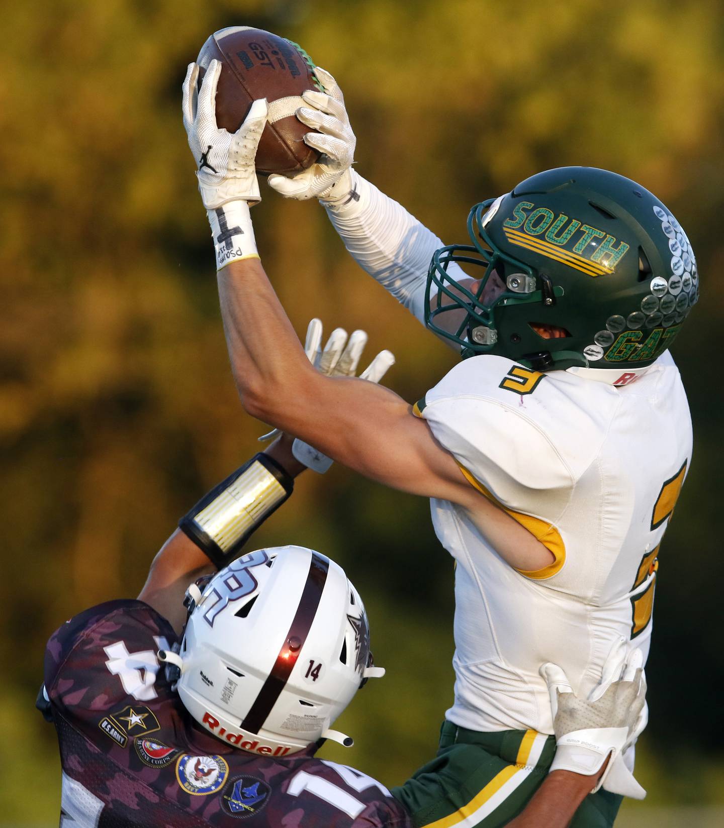 Crystal Lake South's Colton Hess catches a touchdown pass over Prairie Ridge's Nicholas Schons during a Fox Valley Conference football game Friday, Sept. 1, 2023, at Prairie Ridge High School inCrystal Lake.