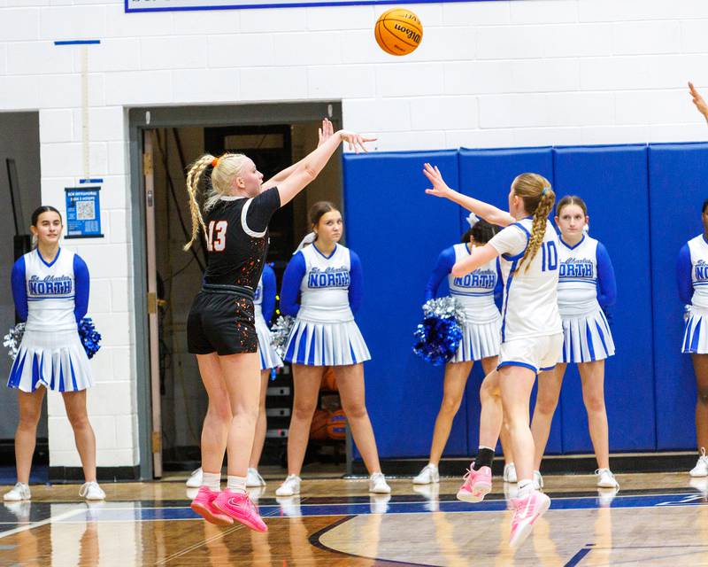 St. Charles East's Addie Schilb shoots a three pointer against St. Charles North on Jan. 30, 2026 in St. Charles.