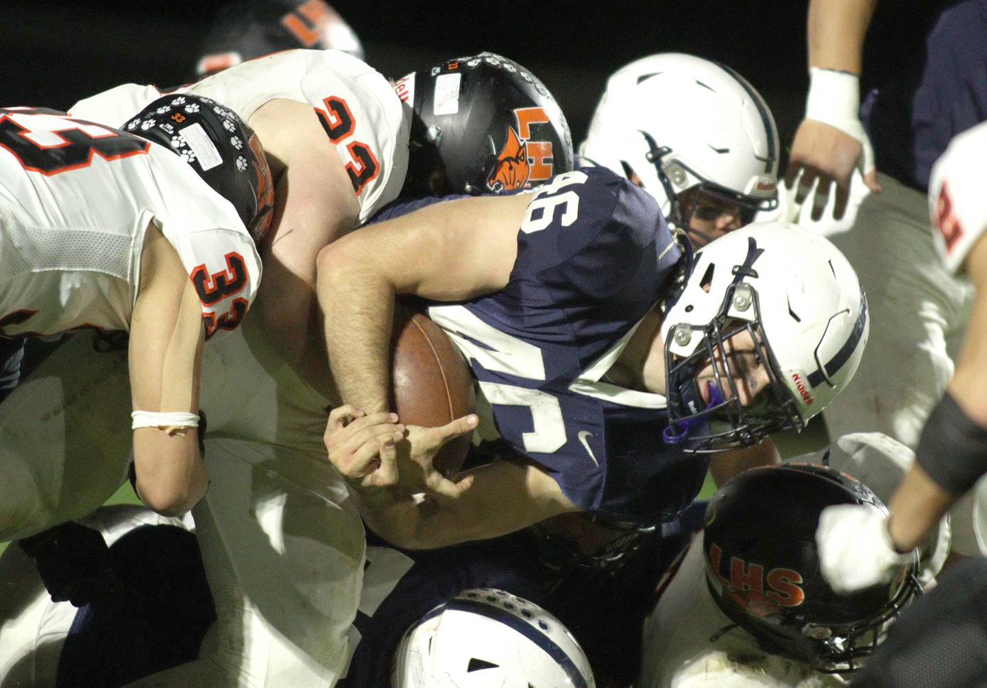 Cary-Grove’s Logan Abrams carries the ball against Libertyville  in first-round Class 6A playoff  football action at Cary Friday.