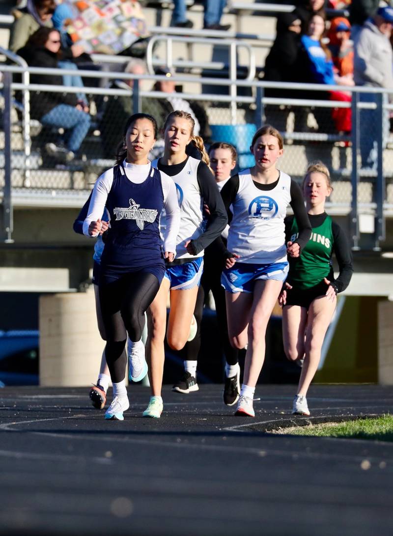 Princeton's Lexi Bohms and Avery Waca run in Thursday's Howard-Monier Girls Invitational at Princeton.