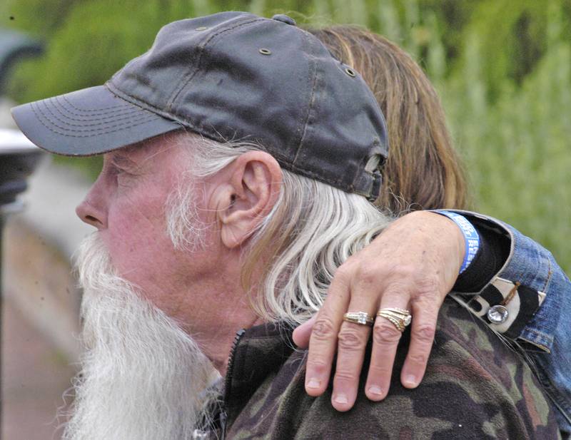 Lance and Gina Robinson of Sterling listen to the music  at  River Country 101.7's Summer Kickoff. The event was held on the Dixon Riverfront June 1, 2024.