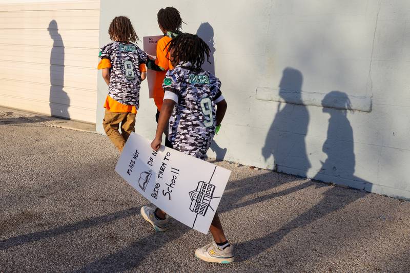 Young participants carry signs opposing gun violence during the 2nd Walk Against Gun Violence in Kankakee on Tuesday, April 29, 2025.
