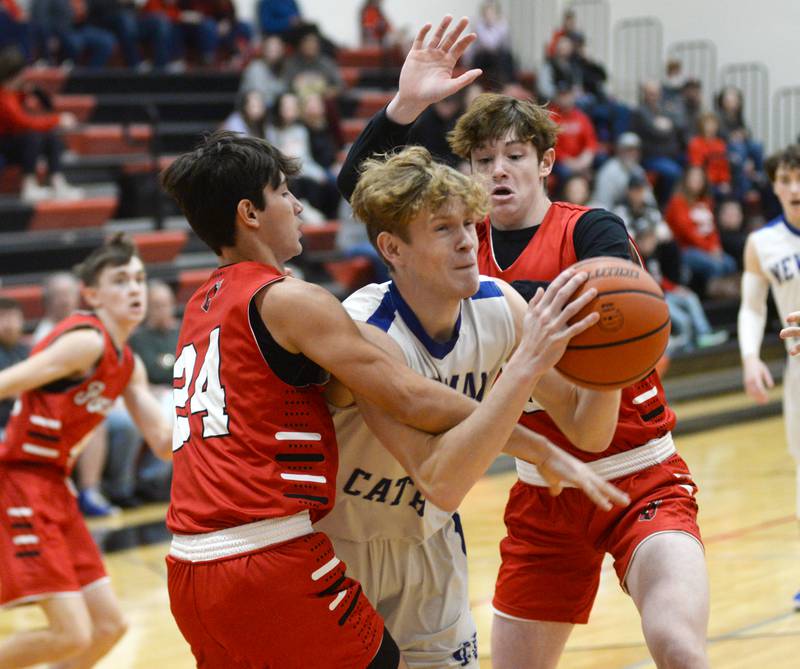 Newman's Lucas Simpson draws the foul as he shoots as Forreston's Mickey Probst (left) and Brendan Gill (right) defend at the 62nd Forreston Holiday Tournament at Forreston High School on Saturday, Dec. 16, 2023.