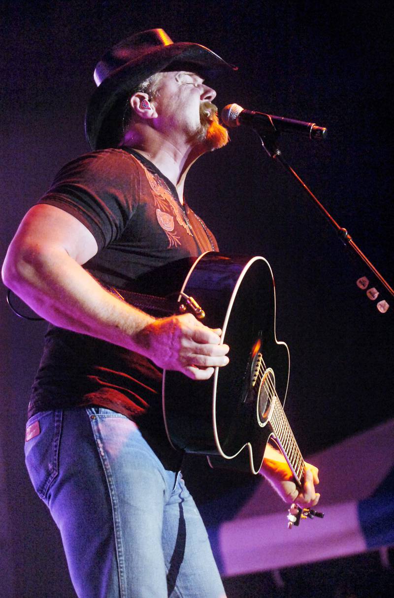 Fans sing along to Trace Adkins as he performed at the Concerts for a Cause series on Saturday, June 25, 2011 at the Illinois Valley Regional Airport in Peru.