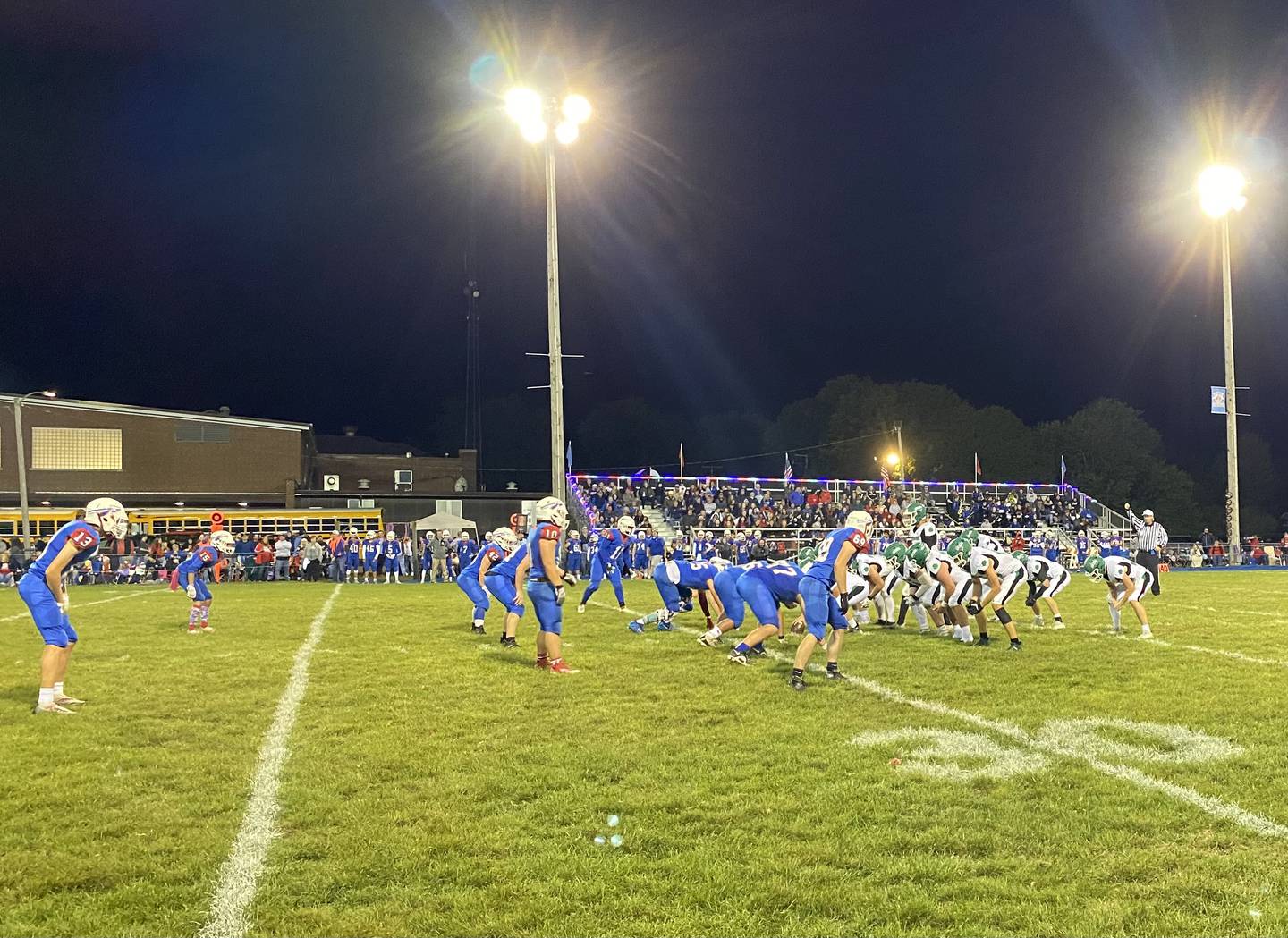The Seneca Fighting Irish offense (in white) lines up for a snap during one of five touchdown drives against Iroquois West on Friday, Sept. 23, 2022, in Gilman.