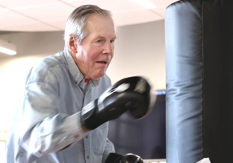 Michael Tiedt punches the heavy bag Friday, April 28, 2023, during Rock Steady Boxing for Parkinson's Disease class at Northwestern Medicine Kishwaukee Health & Wellness Center in DeKalb. The class helps people with Parkinson’s Disease maintain their strength, agility and balance.