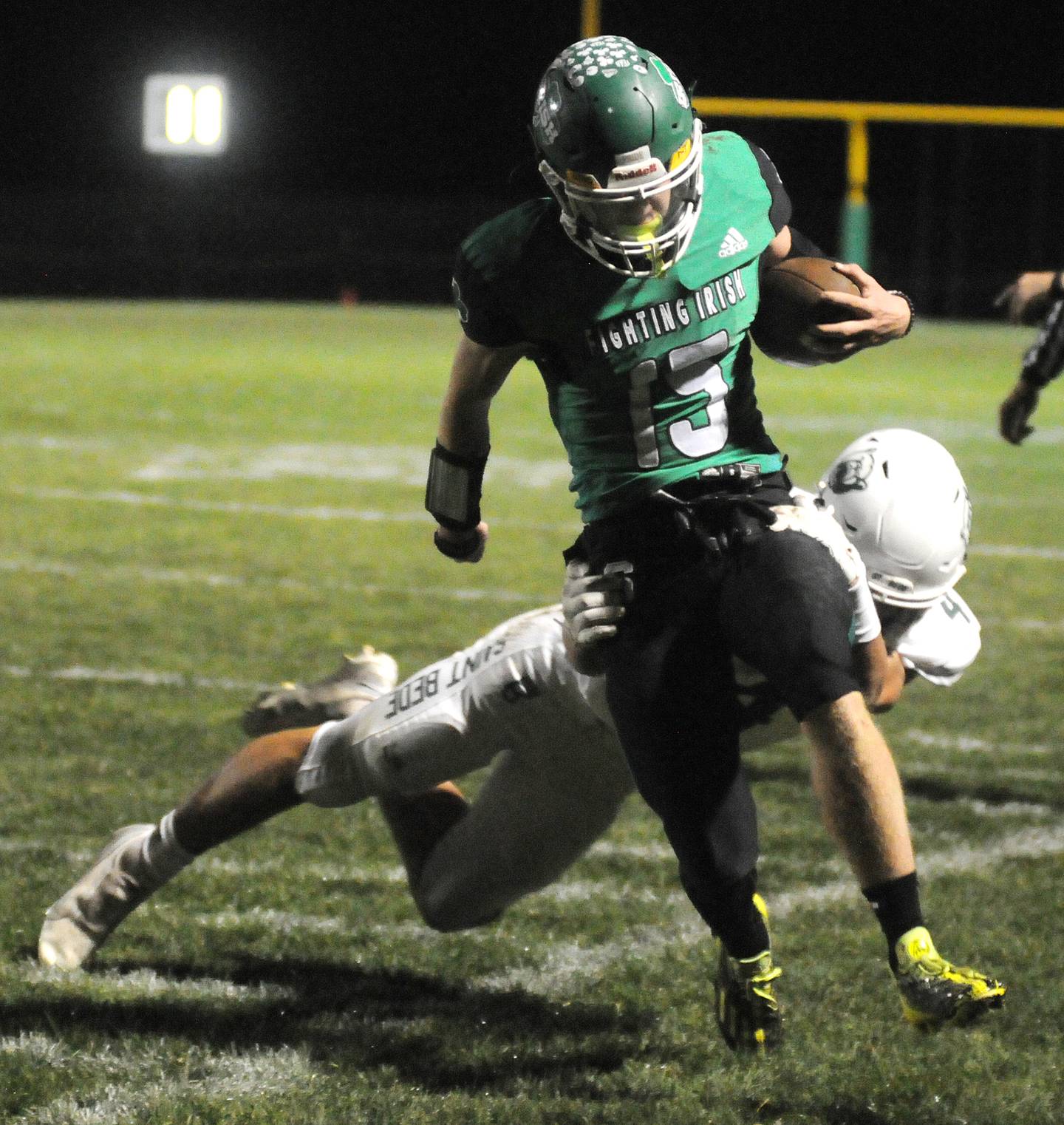Seneca's Paxton Giertz runs out of bounds as St. Bede's AJ Hermes tackles him at Seneca on Friday, Oct. 20, 2023.