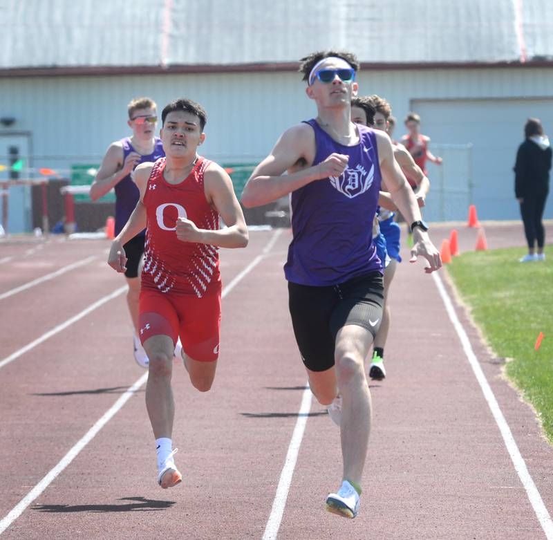 Dixon's Dean Geiger (right) and Oregon's Daniel Gonzalez race to the finish line in the 800 meters at the Gebhardt-Worley Invitational at Oregon High School on Saturday, April 12, 2025. Geiger won the race in 2:02.55 and Gonzalez was second in 2:03.46.